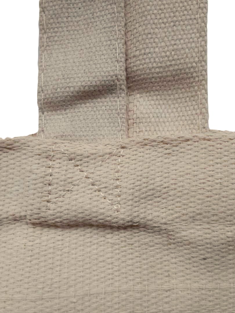 Photo of a tote canvas bag strong stitching.