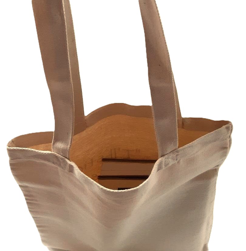 Photo of a canvas tote bag strong handles.
