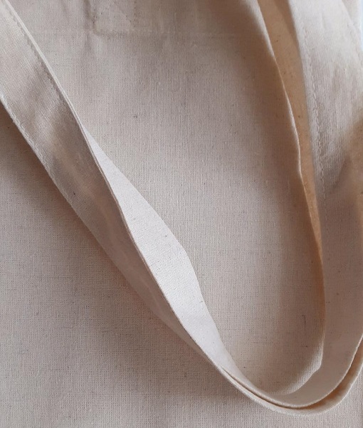 Photo of a strap of a canvas tote bag.